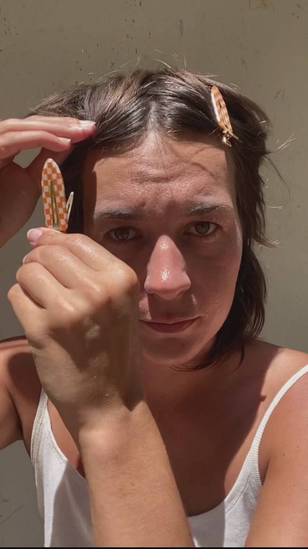 Video of woman putting on honeybee skincare.